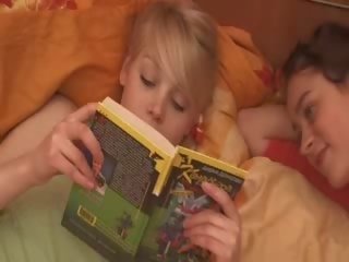 Lezzies reading book and playing